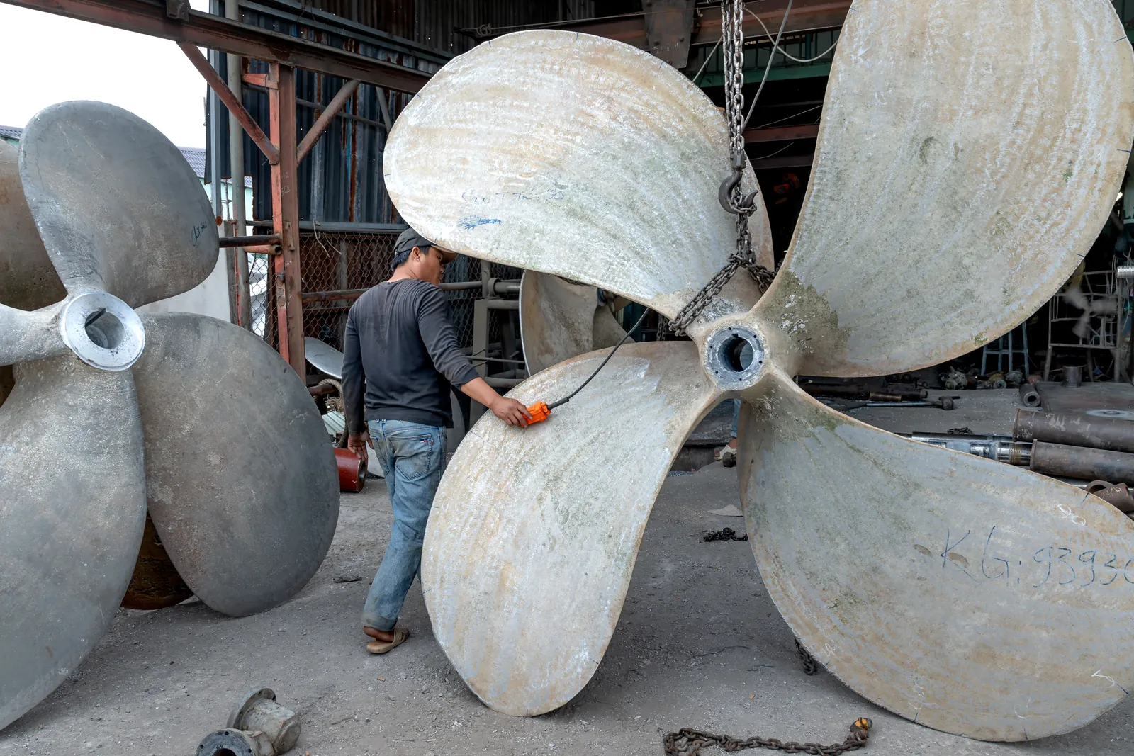 Large ship propellers in a marine engineering workshop